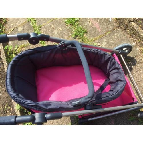 Mooie roze poppenwagen te koop