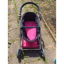 Mooie roze poppenwagen te koop