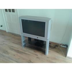 TV + Tv stand + Speakers Gratis