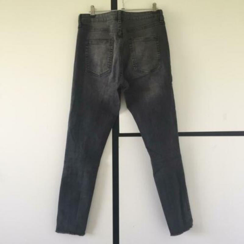 Skinny jeans met scheuren van de H&M in maat s