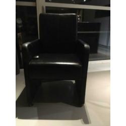Luxe zwarte leren eetkamerstoelen op wieltjes