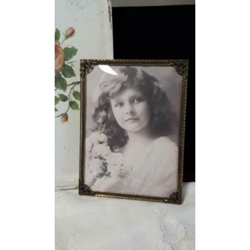 Oude fotolijst met bolglas