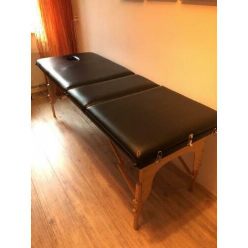Zwarte inklapbare massage tafel kan omhoog bij het ruggedeel